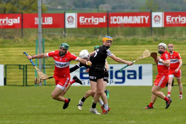 Derry’s Sean Cassidy is tripped Sligo’s Fionn Connolly at Owenbeg on Sunday afternoon.  Photo: George Sweeney. DER2317GS – 03