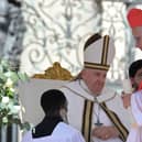 The late Pope Francis elevating to cardinal US prefect of the Dicastery for Bishops Robert Francis Prevost, the current Pope Leo XIV, during a consistory to create 21 new cardinals at St. Peter's Square on September 30, 2023. (Photo by Tiziana FABI / AFP) (Photo by TIZIANA FABI/AFP via Getty Images)
