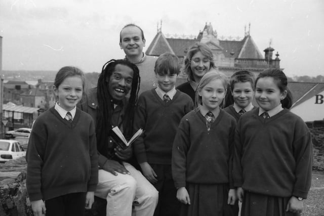 Acclaimed poet Benjamin Zephaniah reading to pupils from Convoy National School following a poetry performance at the Rialto. Included Sean Kelly and Sue O'Dowd.