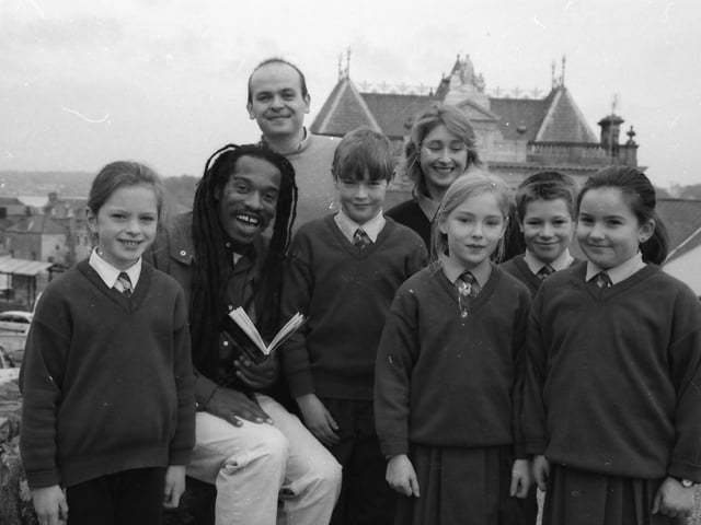 Acclaimed poet Benjamin Zephaniah reading to pupils from Convoy National School following a poetry performance at the Rialto. Included Sean Kelly and Sue O'Dowd.