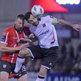 Derry’s Shane McEleney rises with Dundalk striker Patrick Hoban for this high ball. Photograph by Ciaran Culligan