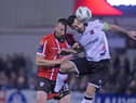 Derry’s Shane McEleney rises with Dundalk striker Patrick Hoban for this high ball. Photograph by Ciaran Culligan