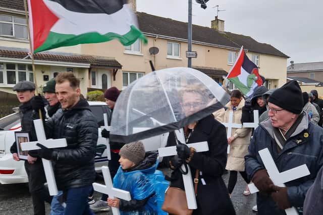 White crosses were carried at the head of the march.