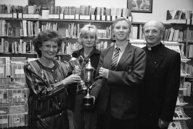 Geraldine Keegan presenting the Headmistress' Special Award for Commitment to Noelle Robinson. Included Claire McNabb and Fr. Brian Brady.