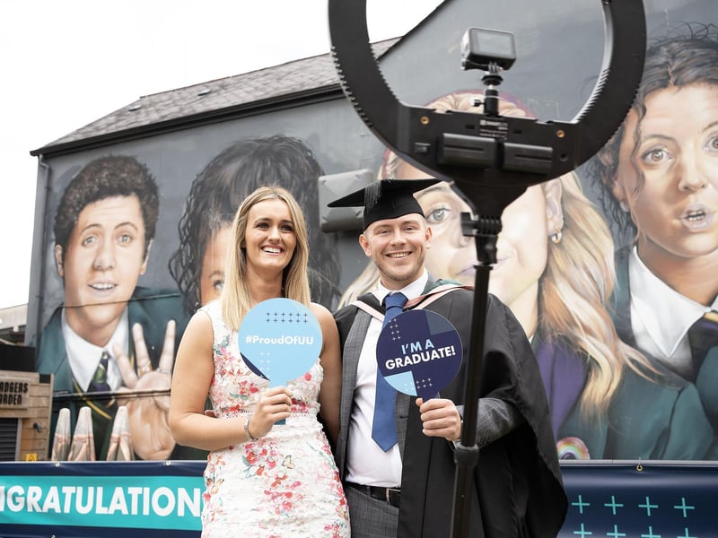 Jack Kelly, Mechanical and Manufacturing Engineering graduate from Derry celebrates with Kerry McGrory as he graduates from Ulster University in Derry on Monday July 8. (Photo: Nigel McDowell / Ulster University)