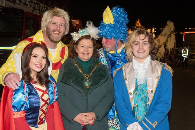 Mayor Patricia Logue with festive characters at the Procession.