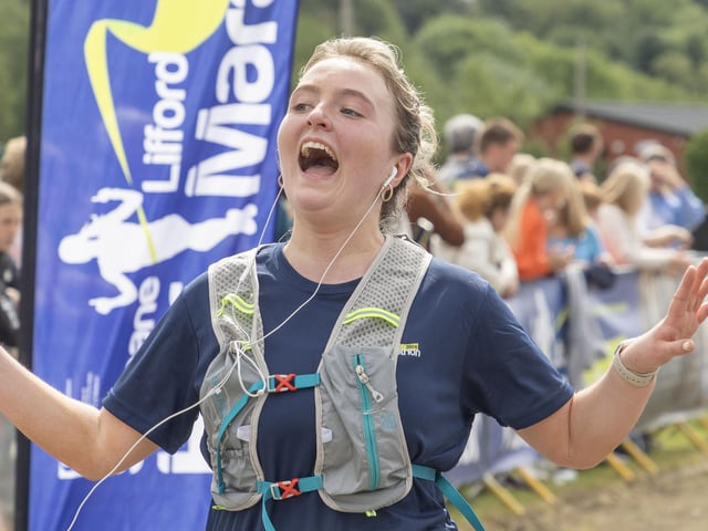 The elation as this runner finsihes the Half Marathon. (North West Newspix)