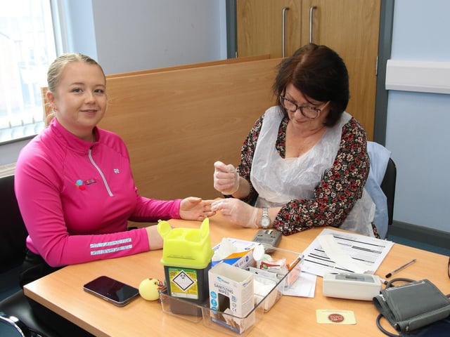 Orla has her cholesterol checked by Patricia at Skeoge Community Health Fair.  (Photo - Deirdre Heaney, nwpresspics)
