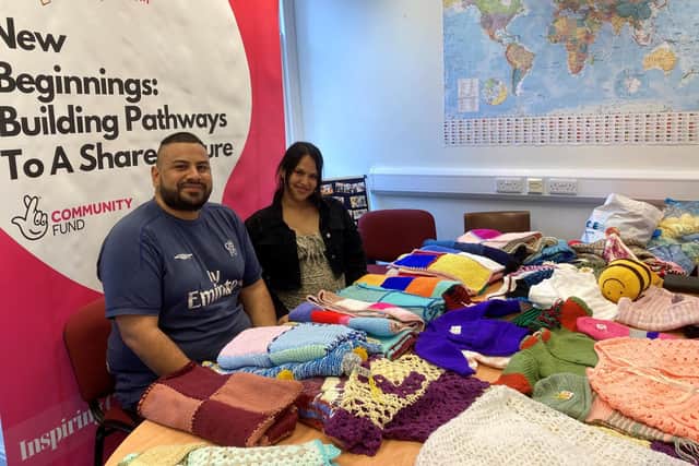 Pedro Sanchez and Katarine Rodriguez picking up some knitted items for their soon-to-be-born baby. Katarine is due to give birth in November.