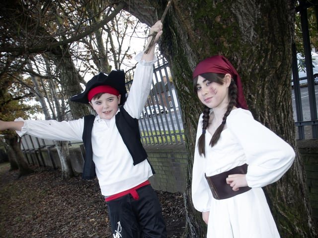 P7 pupils Olivia and Emmett show off their costumes on Friday. : .
