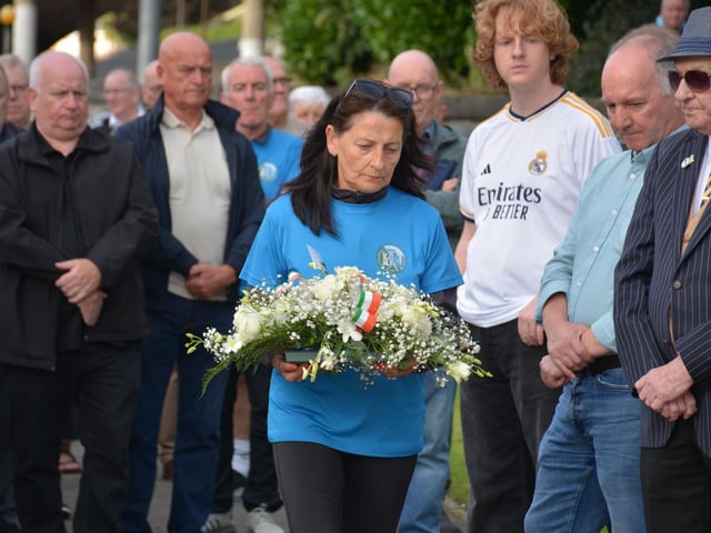 A member of the English family lays a wreath in memory of Charles.