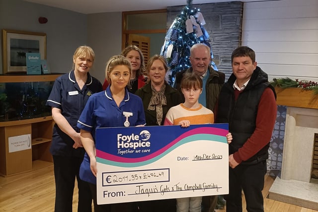 The Foyle Hospice have said 'thank you' to the lovely friends and family of Jacqui Campbell who raised an amazing €2011.35 and £476.49, proceeds of a Coffee Morning held in Jacqui’s memory at Quigley’s Point Community Centre. Jacqui’s Girls and the Campbell family are pictured here presenting a cheque to Foyle Hospice staff.