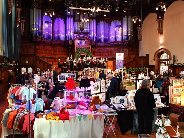 People browse the large range of gifts at the Guildhall Christmas Fair on Friday afternoon. Photo: George Sweeney / Derry Journal