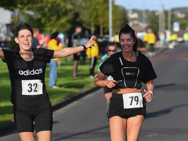 Rachel Barr (32) and Sinead Crossan (79 ) finish the inaugural Galliagh Féile 5K road race on Friday evening.  Photo: George Sweeney