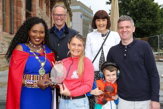 Mayor of Derry, Councillor Lilian Seenoi Barr, presenting a civic gift to Gemma Thompson, City of Derry Spartans Athletic Club, at in reception in the Guildhall following her recent success in winning 2 medals at the European Masters Indoor Championships in Poland. Gemma won the medals in the 200m and 60m setting an Irish Record. Included are Gemma’s husband Eoghan Tucker and son Shane (7), and her parents Davy and Patricia Thompson.(Photo: Lorcan Doherty)Photo Lorcan Doherty