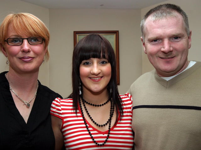Bronagh smiles for the camera with aunt Teresa and uncle Declan on the occasion of her 18th birthday 0172JML : Parties and celebrations January 2006: Bronagh Halpenny.