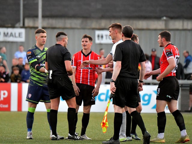 Derry City players approach referee Rob Hennessy after the final whistle. DER2321GS -