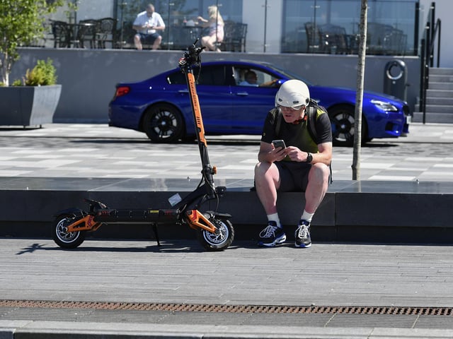 Taking a break at Ebrington Square to enjoy the sunshine. Photo: George Sweeney