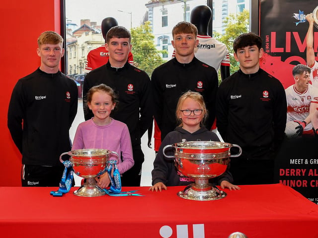 Cliodhna and Catherine Currie pictured with members of Derry's All-Ireland Minor Champions team at O'Neill's Superstore on Saturday afternoon. Photo: George Sweeney