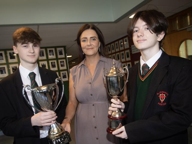 Senior Teacher Mrs Edwards presents Jordan Kelly and Harley Nixon with their cups for Top Achievement at GCSE during the St. Joseph's Boys School Annual Prizegiving on Thursday last. (Photos: Jim McCafferty Photography)