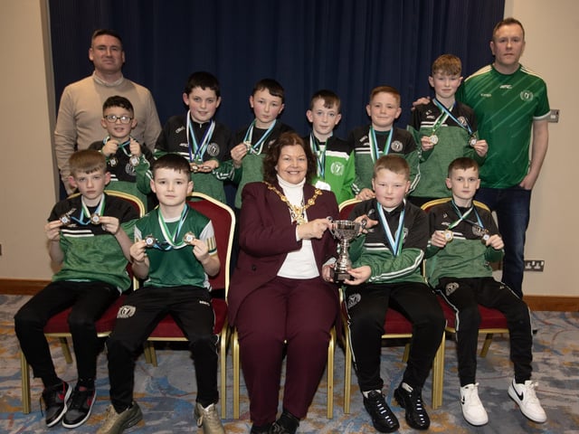 The Mayor, Patricia Logue, pictured at the D&D Youth FA Annual Awards at the City Hotel on Friday night presents Foyle Harps u-12s with the Winter Cup.. Included are coaches Sean McGuinness and John Canning.