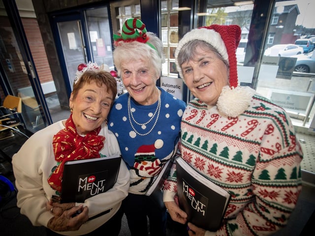 Some of the lovely ladies from the Momentum Choir posing for a photo during Derry Credit Union Santa Saturday event. : .