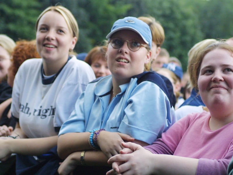 Three young fans enjoying the concert.(2808JB20)