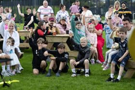 Families enjoying 'It's A Kind of Magic'  with magician Caolan McBride pictured during the Feile's event at Bishop's Field, Creggan on Monday evening. (Photos: Jim McCafferty Photography)
