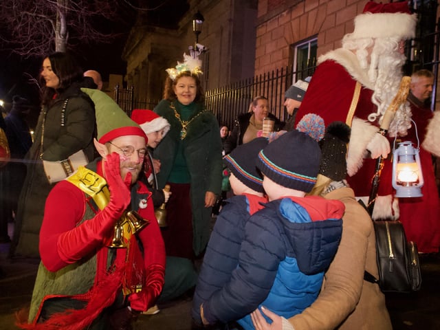 The Mayor and Santa's little helpers meeting young people on the parade.