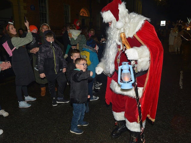 Santa greeting children at the Derry Christmas procession on Sunday evening last. Photo: George Sweeney. DER2248GS - 24
