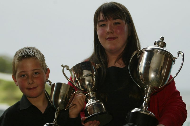 Shaun and Louise McDaid who won Speech and Drama competitions at Moville Feis. Shaun won the Boys open  10 - 12 yrs and Louise won the open 12 - 15 yrs and also the Bord Iascaigh Mhara Cu-p for Best overall.  They are students of the Keegan Academy of Speech and Drama.  (1305JB06)