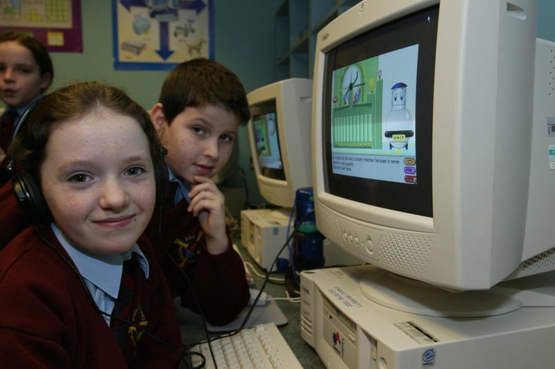 St Eithne's PS pupils Dearbhla Hillick and Conor McFeely working at one of the new computer suites in the school.