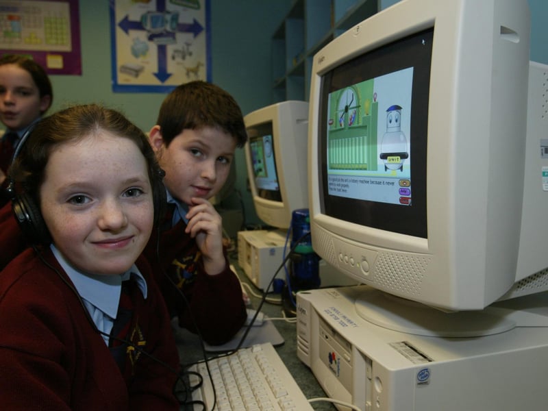 St Eithne's PS pupils Dearbhla Hillick and Conor McFeely working at one of the new computer suites in the school.
