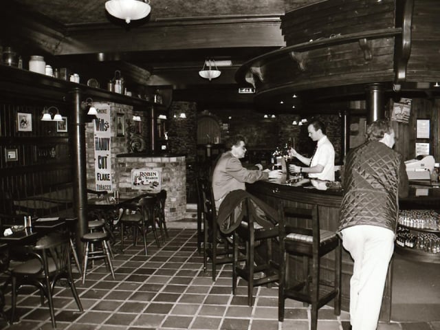 Staff and customers at Duke's Bar in the Waterside.