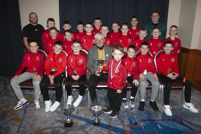 John ‘Jobby’ Crossan pictured with the Newell Academy and Newell Academy Colts 2012's teams who were Winter and Summer Cup winners 2023, during the Annual Awards in the City Hotel on Friday night last.