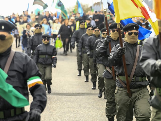Members of the Colour Party marching down Iniscarn Road at the Saoradh Easter Commemoration to City Cemetery.  (Photo - Tom Heaney, nwpresspics)