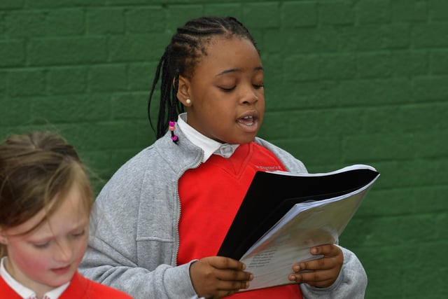 Pupil from St Eugene's Primary School's choir singing 'All Kinds of Everything' at the mural of St Columba, in Columbcille Court, celebrating the patron saint of Derry's feast day.  Photo: George Sweeney