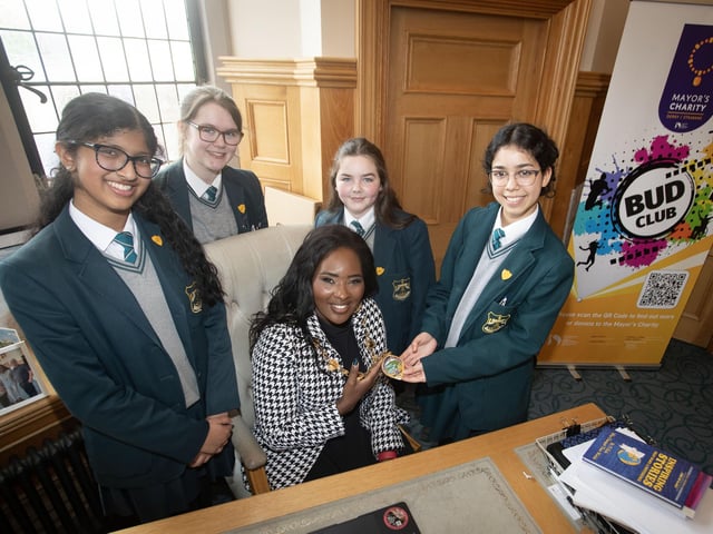 The Mayor, Lilian Seenoi-Barr showing her chain of office to Thornhill students Johanna Sebastian, Erin Brown, Jessica MacHugh and Sarah Gad during Tuesday's visit to the Guildhall.