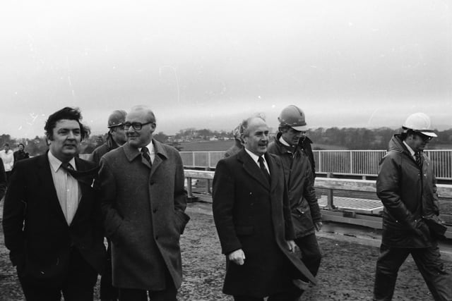 SDLP Leader John Hume with construction firm representatives and dignitaries during a visit by the European Commissioner for European Commissioner for Taxation, Consumer Affairs, Transport and Parliamentary Relations,  and Inter-institutional Relations and Administration, Richard Burke.