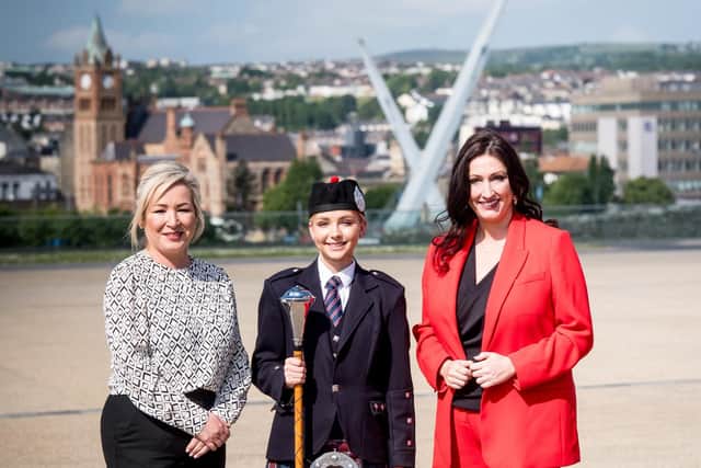 Pictured left to right are; First Minister Michelle O’Neill, Drum Major Jamie-Lee Wilson - Bready Ulster Scots Pipe Band and deputy First Minister Emma Little-Pengelly.