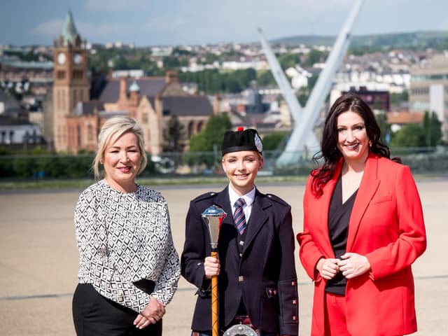 Pictured left to right are; First Minister Michelle O’Neill, Drum Major Jamie-Lee Wilson - Bready Ulster Scots Pipe Band and deputy First Minister Emma Little-Pengelly.