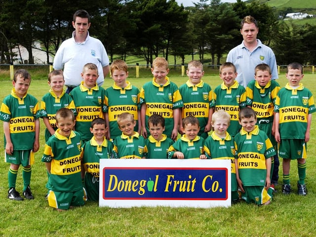 Members of the U-8 boys team taking part in the Malin GAA Summer Camp at Glengad.Included, are Michael Byrne, coach, and Eamon Redden, County player. (2007A05)