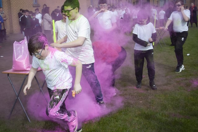 ABSOLUTELY CLATTERED!. . . .Some of the students making their way around the Colour Run course at St. Joseph’s Boys School.