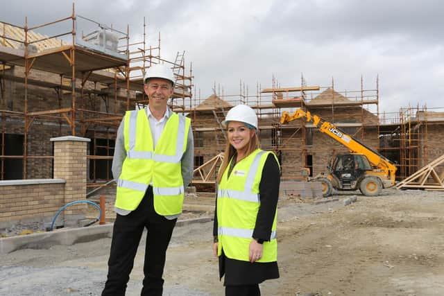 Jason Hardy, Head of Development and Katrina Smyth, Director of Development, Habinteg Housing Association, at the Beechmount Village site in Strabane.