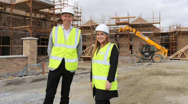 Jason Hardy, Head of Development and Katrina Smyth, Director of Development, Habinteg Housing Association, at the Beechmount Village site in Strabane.