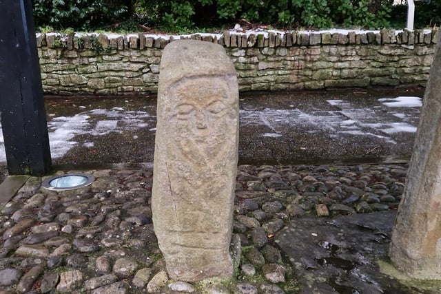 Stone pillar beside the 7th Century Carndonagh Cross in Donegal.