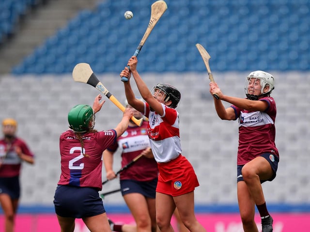 Derry’s Olivia Rafferty jumps for a high ball with Emily McCabe and Maria Kelly of Westmeath  (Photo: INPHO/Ryan Byrne).