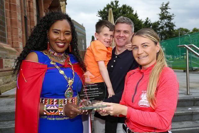 Mayor of Derry, Councillor Lilian Seenoi Barr presenting a civic gift to Gemma Thompson, City of Derry Spartans Athletic Club, at in reception in the Guildhall following her recent success in winning two medals at the European Masters Indoor Championships in Poland. Gemma won the medals in the 200m and 60m setting an Irish Record. Included are Gemma’s husband Eoghan Tucker and son Shane (7). (Photo: Lorcan Doherty),Photo Lorcan Doherty