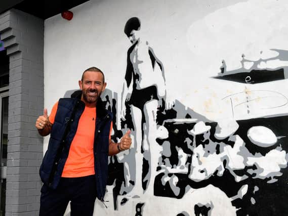 Micky Doherty pictured at the mural of Len Ball in Creggan’s Central Drive. Photo: George Sweeney.  DER2317GS – 40