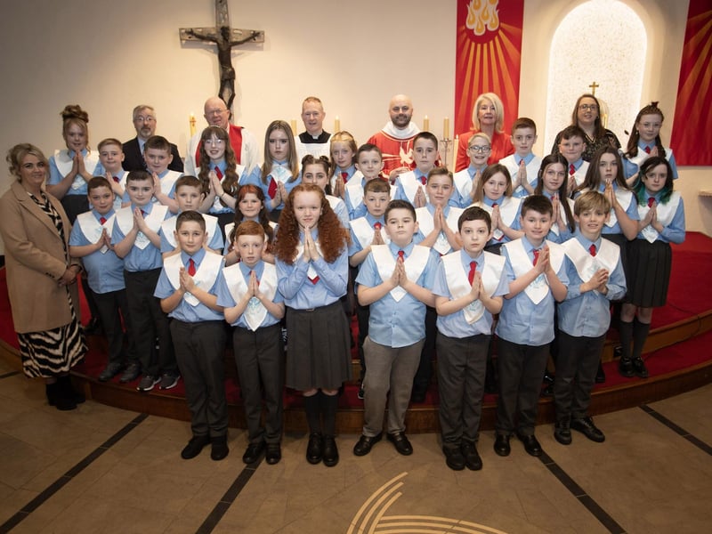 ST. BRIGID'S CONFIRMATION. . . . .Pupils from Mr. O'Doherty's class at St. Brigid's Primary School who received the Sacrament of Confirmation from Fr. Chris McDermott at St. Brigid's Church, Carnhill on Thursday last. Included from left are Ms. Gemma McCloskey, Mr. Paul O'Doherty, Fr. Michael McGaughey, Fr. Sean O'Donnell, Fr. Chris McDermott, Ms. Mary McCallion, Principal and Mrs. Danielle McLaughlin. (Photos Jim McCafferty Photography)